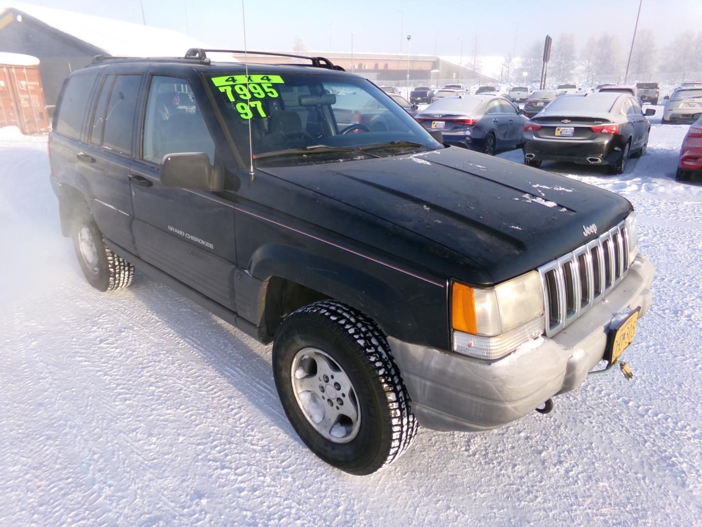 1997 Black Jeep Grand Cherokee Laredo 4WD (1J4GZ58S6VC) with an 4.0L L6 OHV 12V engine, 4-Speed Automatic Overdrive transmission, located at 2630 Philips Field Rd., Fairbanks, AK, 99709, (907) 458-0593, 64.848068, -147.780609 - Photo#0